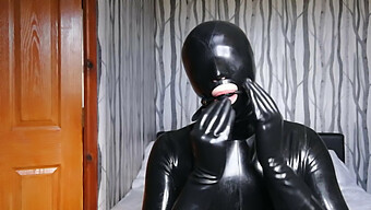 Latex-Clad Fetishist Gets Blindfolded, Gagged, And Wears Gas Mask